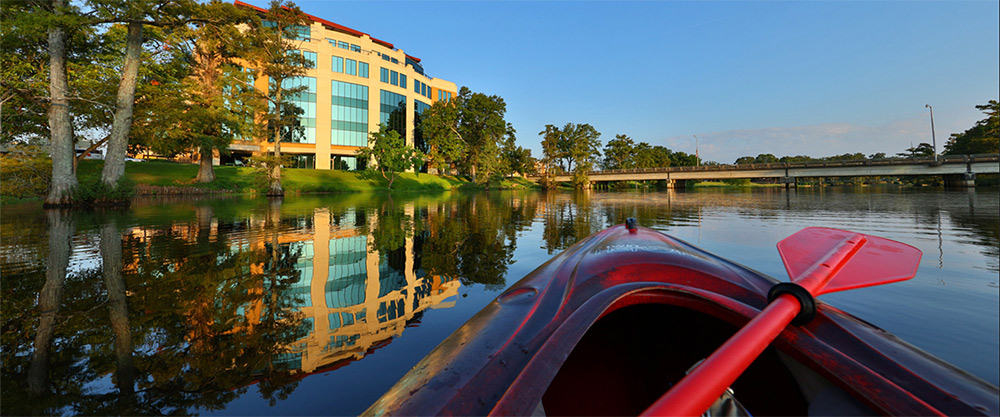 kayak on Bayou DeSiard view of the library